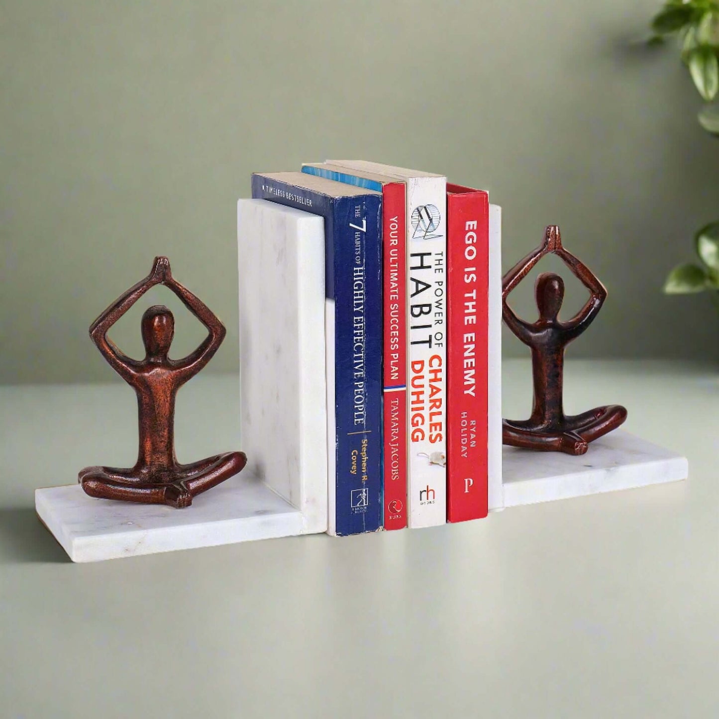 Decorative bookends for holding up books on a shelf